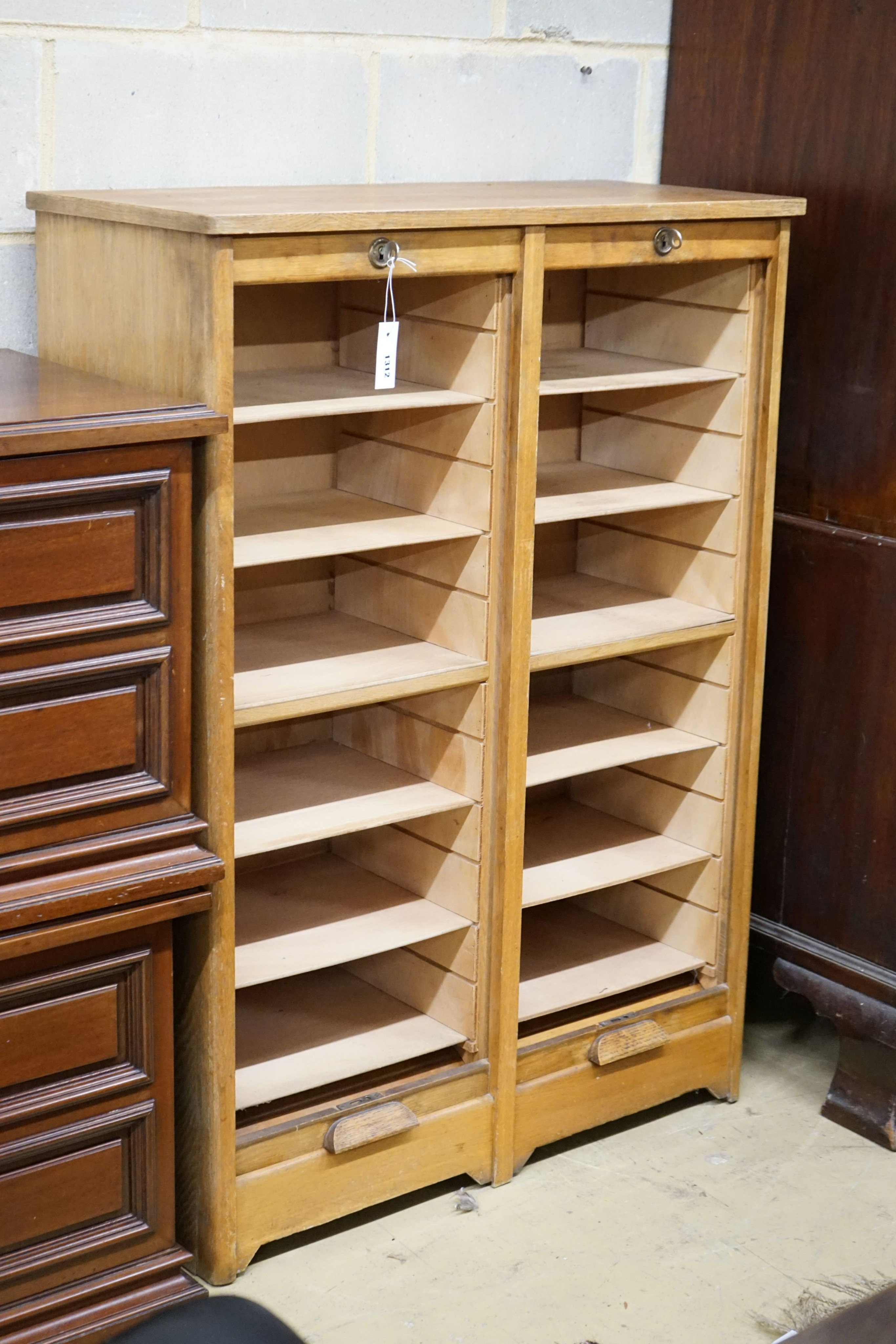 A mid 20th century oak tambour double filing cabinet, width 86cm, depth 38cm, height 120cm